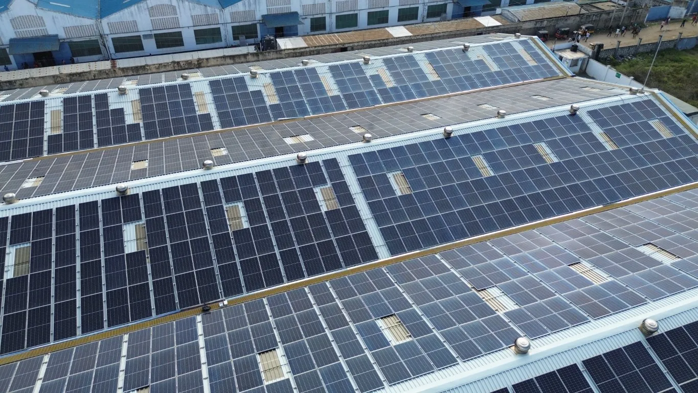 Aerial view of a large industrial rooftop solar PV installation